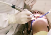 Signs to visit dentist. Dentist treating female patient